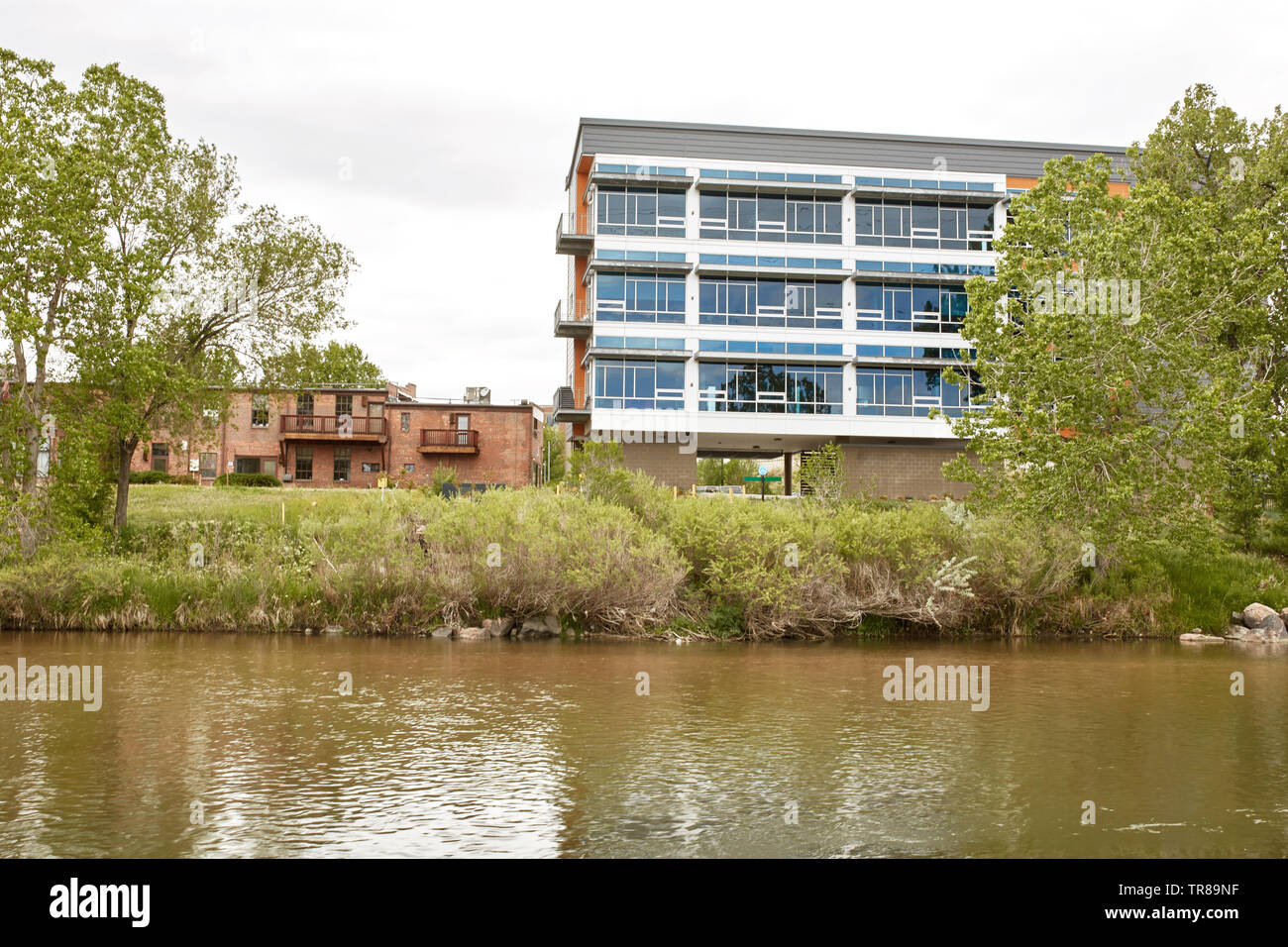 Condos and highrise buildings near Platte River at Confluence Park in