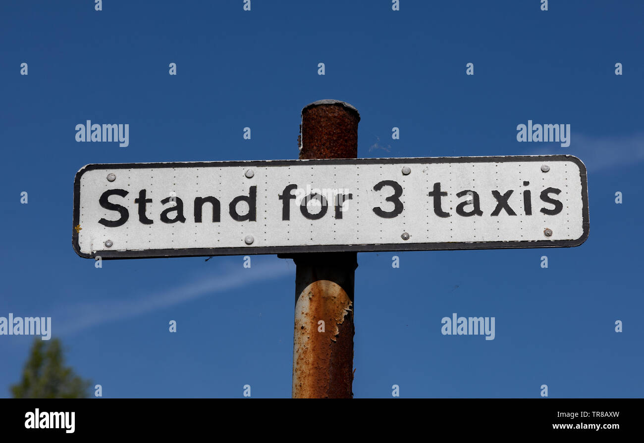 Sign indicating a taxi stand for three taxis in the town centre of