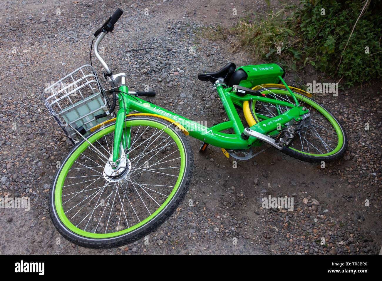 Lime electric bike on pavement hires stock photography and images Alamy
