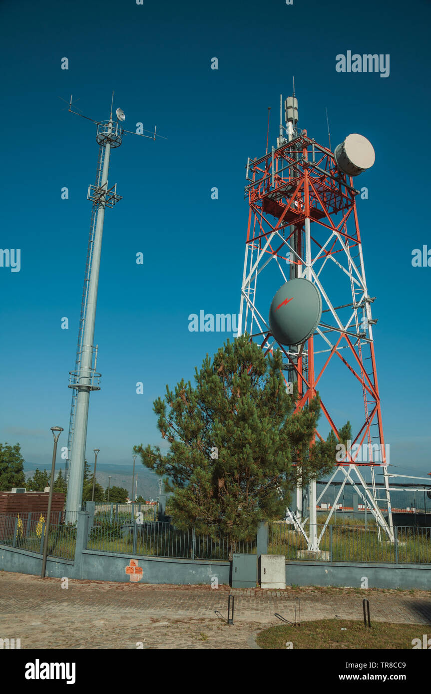 Telecommunication towers with antennas on a base transceiver station at Guarda. A well-kept medieval town in the eastern Portugal. Stock Photo