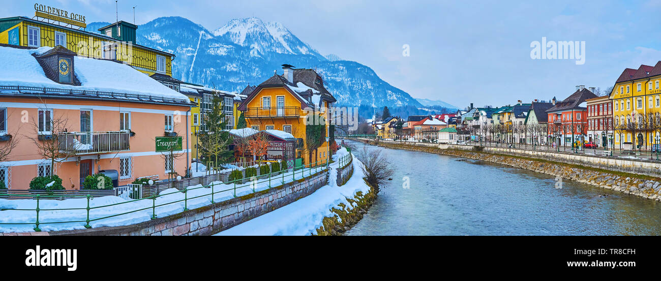BAD ISCHL, AUSTRIA - FEBRUARY 20, 2019: Panorama of the banks of Traun river with old town quarters, historic housing and foggy Katrin Mount on the ba Stock Photo