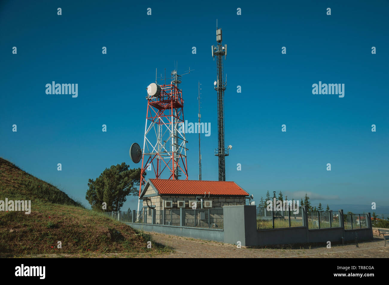 Telecommunication towers with antennas on a base transceiver station at Guarda. A well-kept medieval town in the eastern Portugal. Stock Photo