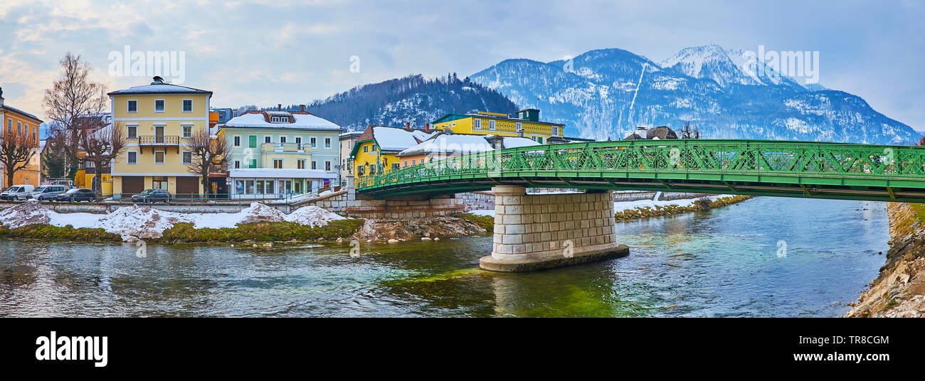 Panorama with old green bridge of Kaiserin Elizabeth, connecting the banks of Traun river, with a view on old edifices and Mount Katrin on background, Stock Photo