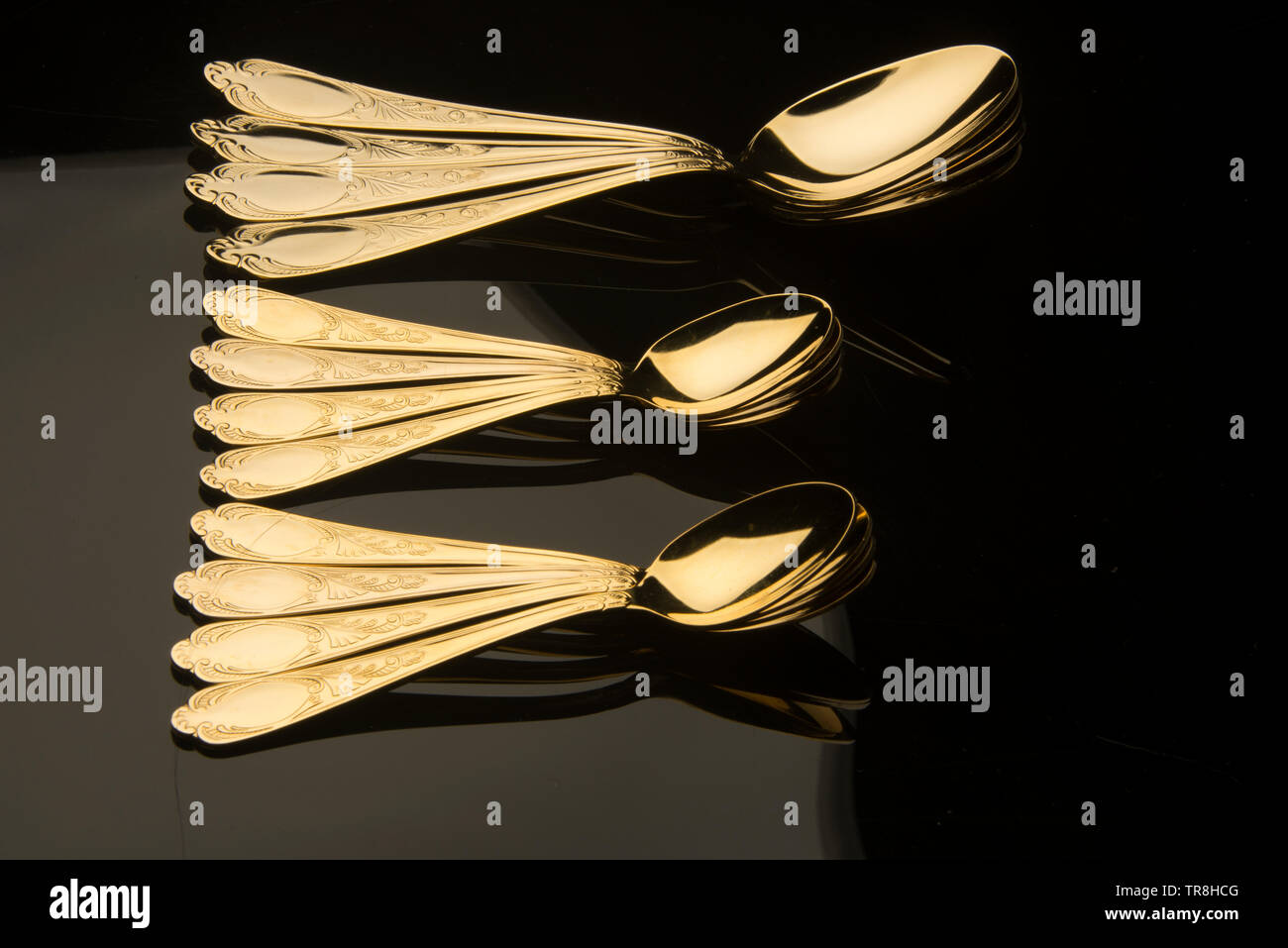 Beautiful gold desert spoons Stock Photo