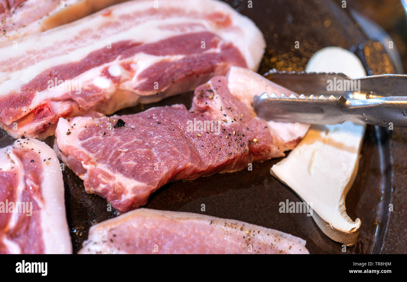Panfried black pork meal in Korea restaurant, fresh delicious korean