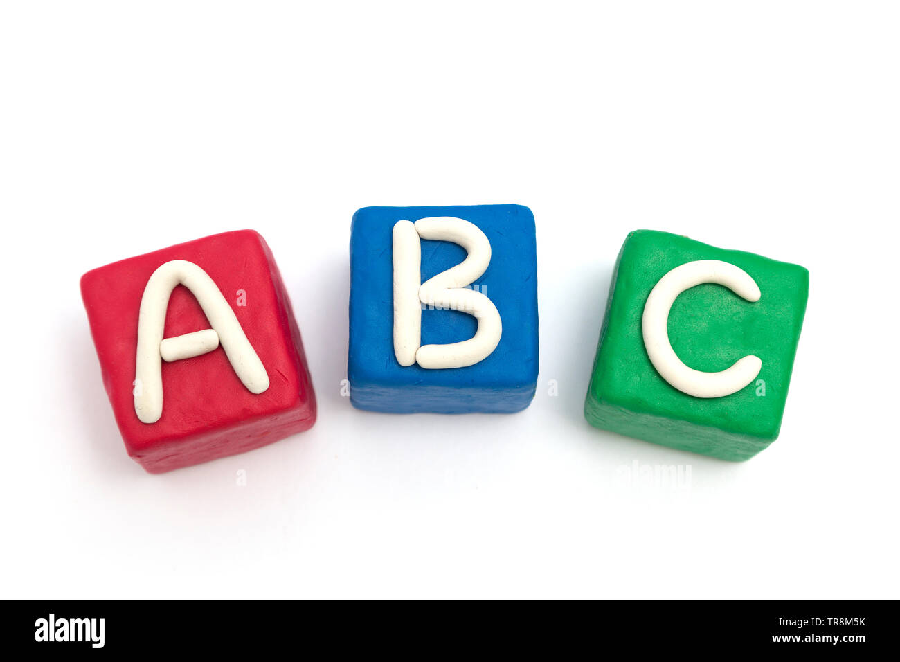 Blocks made of modeling clay with letters A B C, isolated Stock Photo