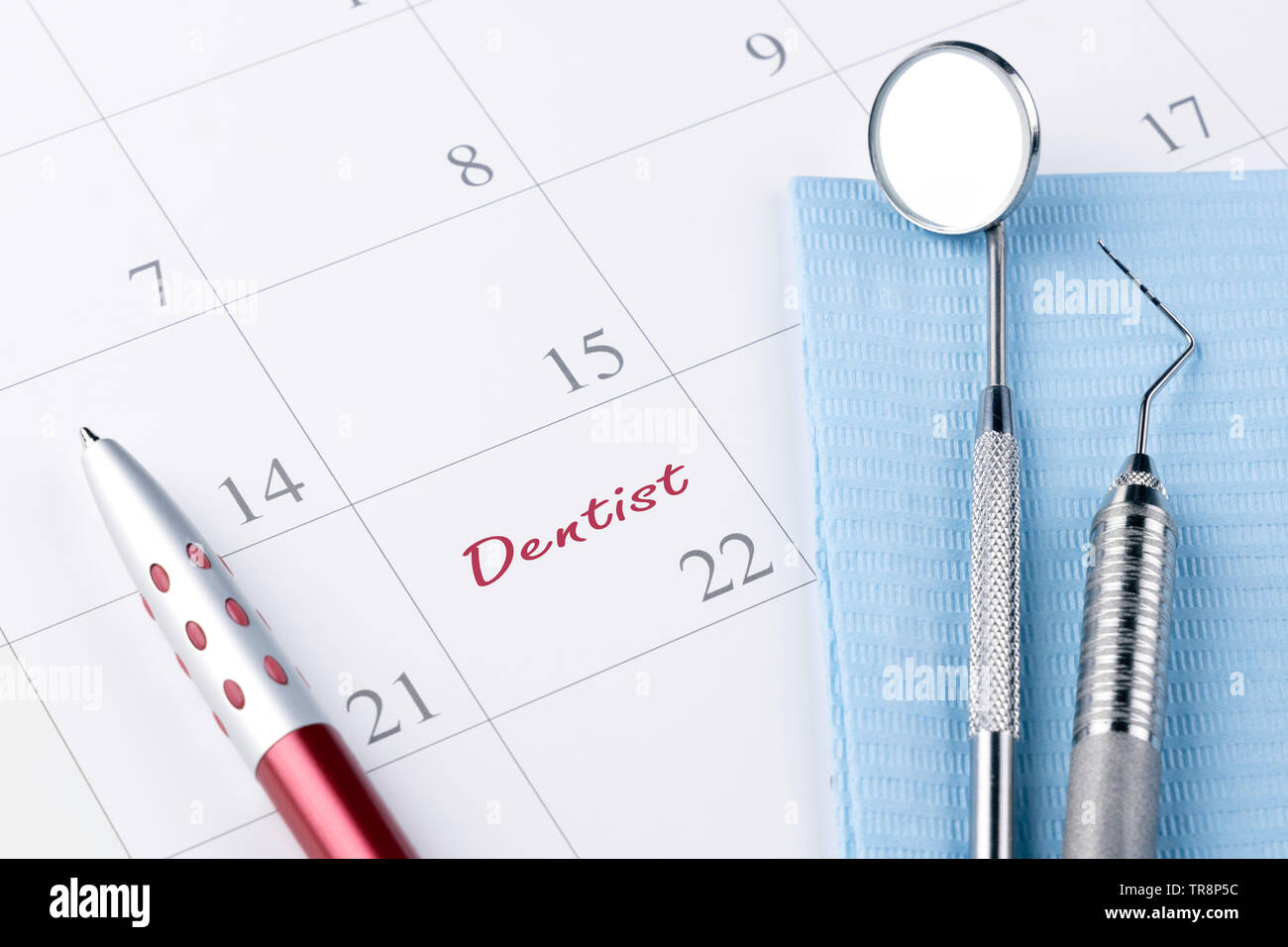 Dentist appointment in calendar pen and professional dental tools