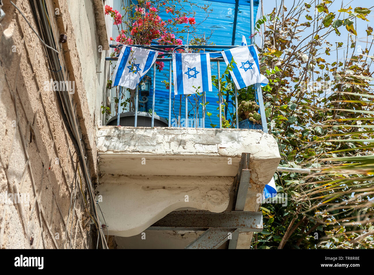 Israel, Tel Aviv - 24 April 2019: Israeli flags on a a balcony in Jaffa on Yom haatzmaut Stock Photo