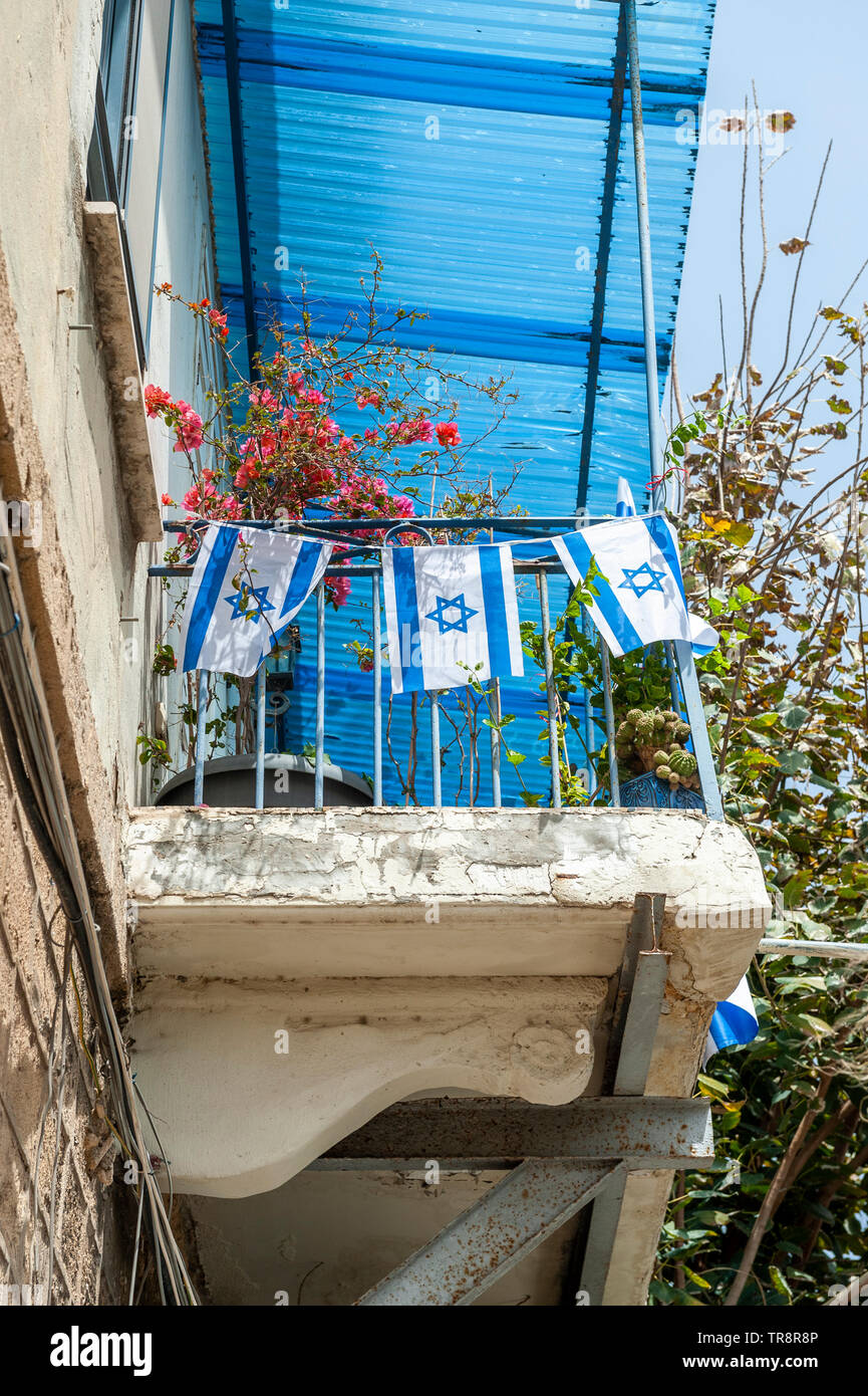 Israel, Tel Aviv - 24 April 2019: Israeli flags on a a balcony in Jaffa on Yom haatzmaut Stock Photo