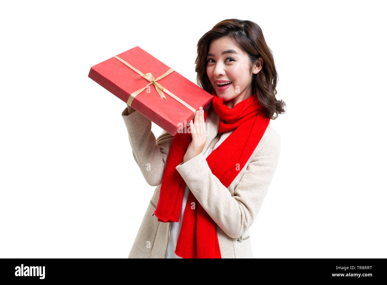 Happy young woman holding gift Stock Photo