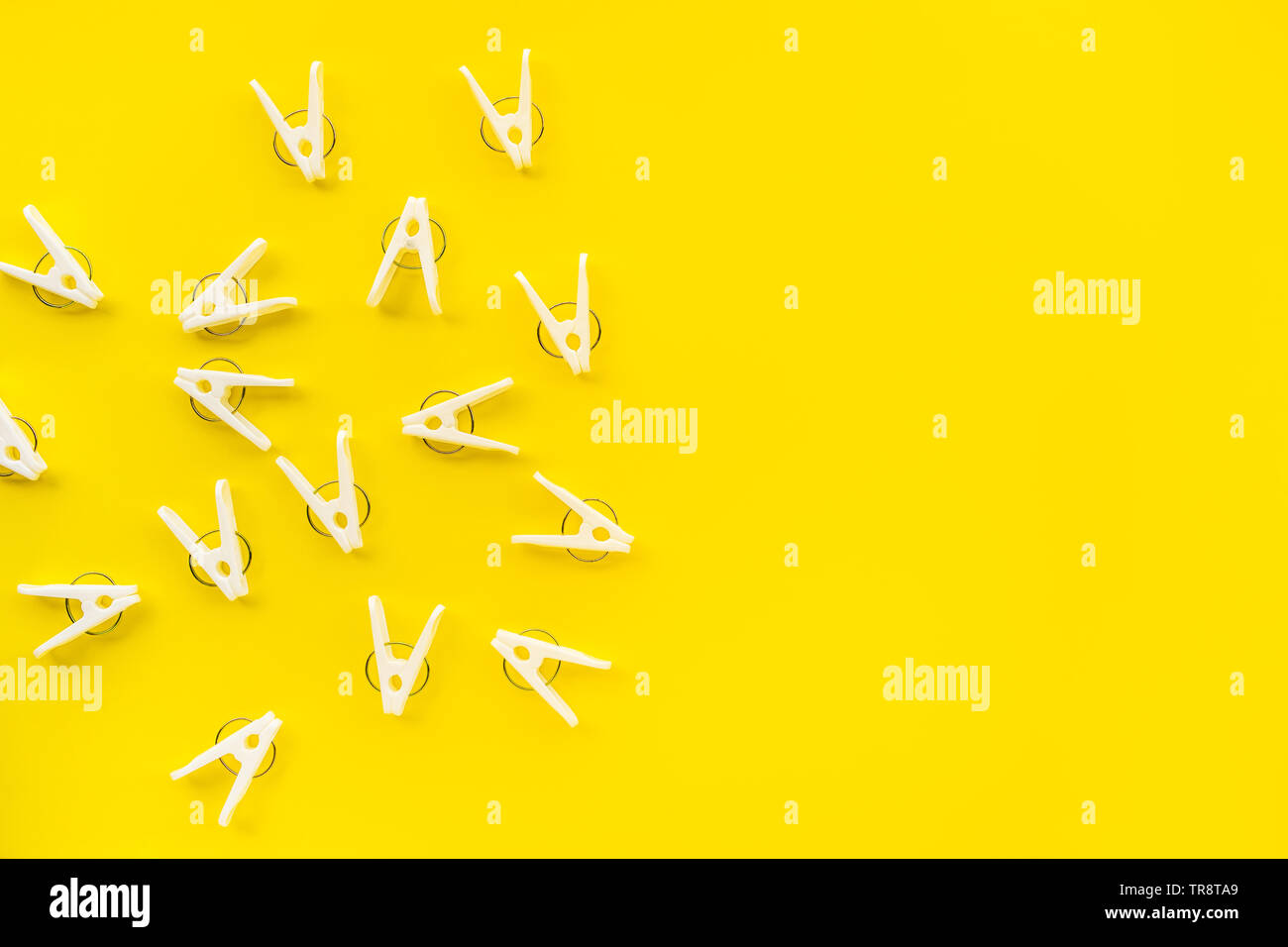 clothespins on yellow color background,copy space Stock Photo