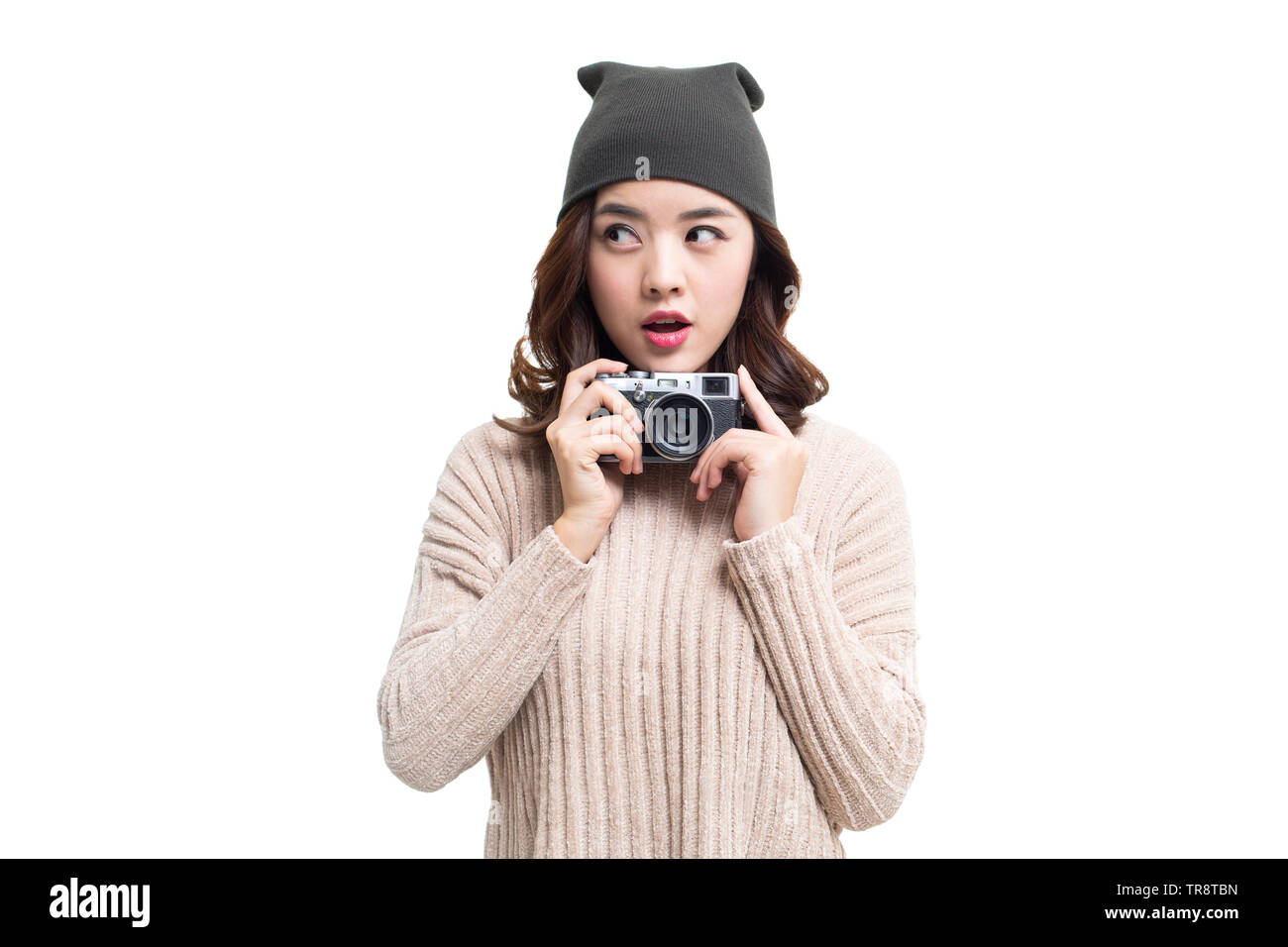 Young woman holding camera Stock Photo - Alamy