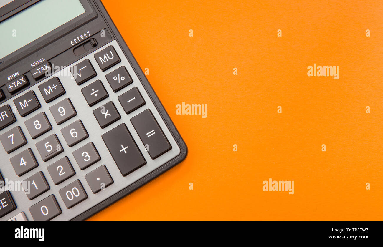 Side View Of A Black Accounting Calculator With Numbers On Display Against A Background Of Scattered Hundred Dollar Bills With Copy Space Profit Inc Stock Photo Alamy