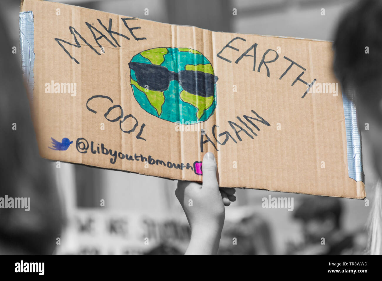 Make earth cool again sign being held at Youth Strike 4 Climate at Bournemouth, Dorset UK in May Stock Photo