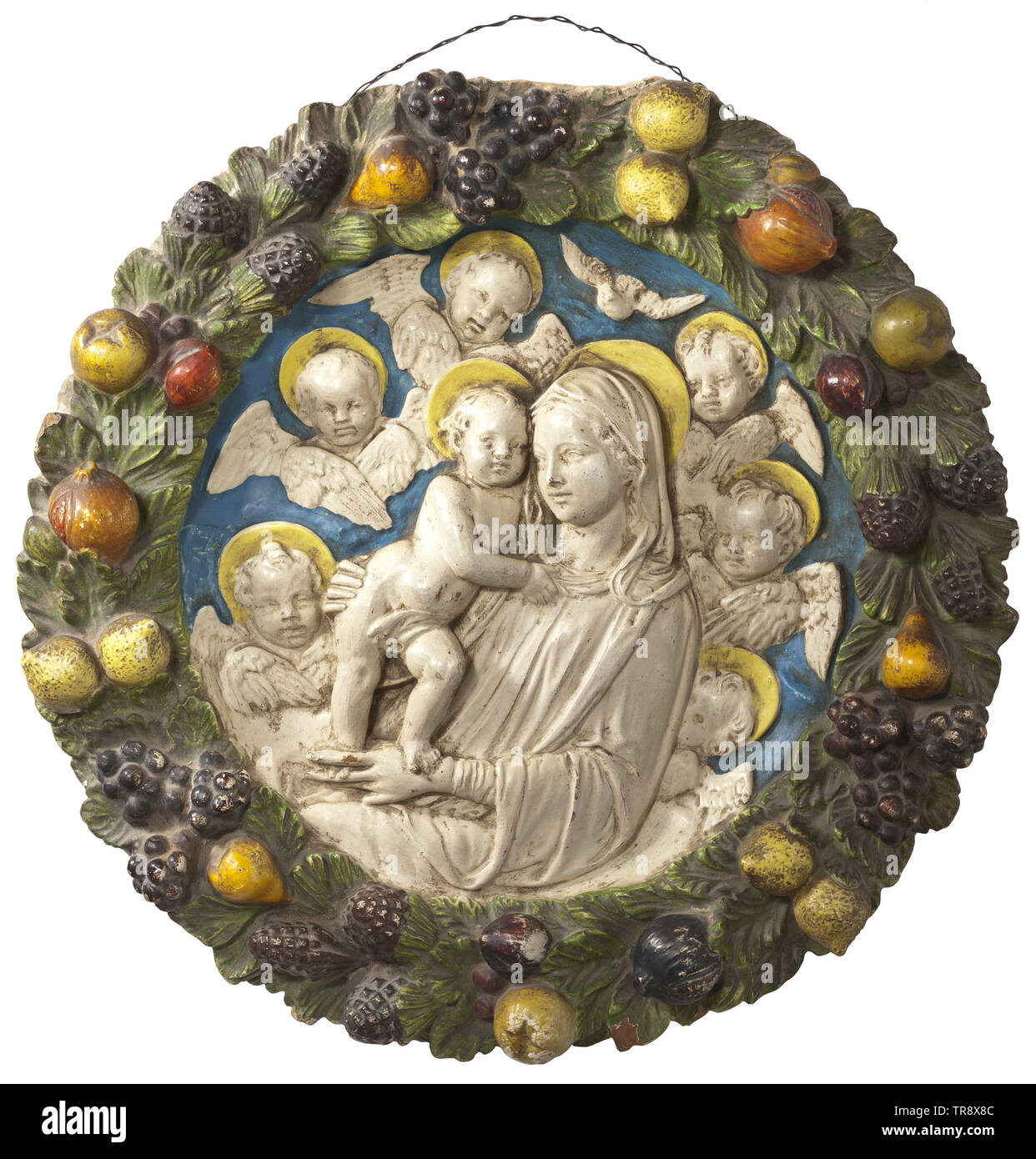 A large Italian relief tondo in the style of Andrea della Robbia, circa 1900 Reddish clay with polychrome cold painting. In the centre a Virgin Mary in high relief, rendered in white, with the standing boy Jesus surrounded by winged angels' heads on blue ground. The edge with a polychrome leaf and fruit bouquet in relief. Minimal damages and colour chippings. Diameter 64 cm. historic, historical, handicrafts, handcraft, craft, object, objects, stills, clipping, clippings, cut out, cut-out, cut-outs, 20th century, Additional-Rights-Clearance-Info-Not-Available Stock Photo
