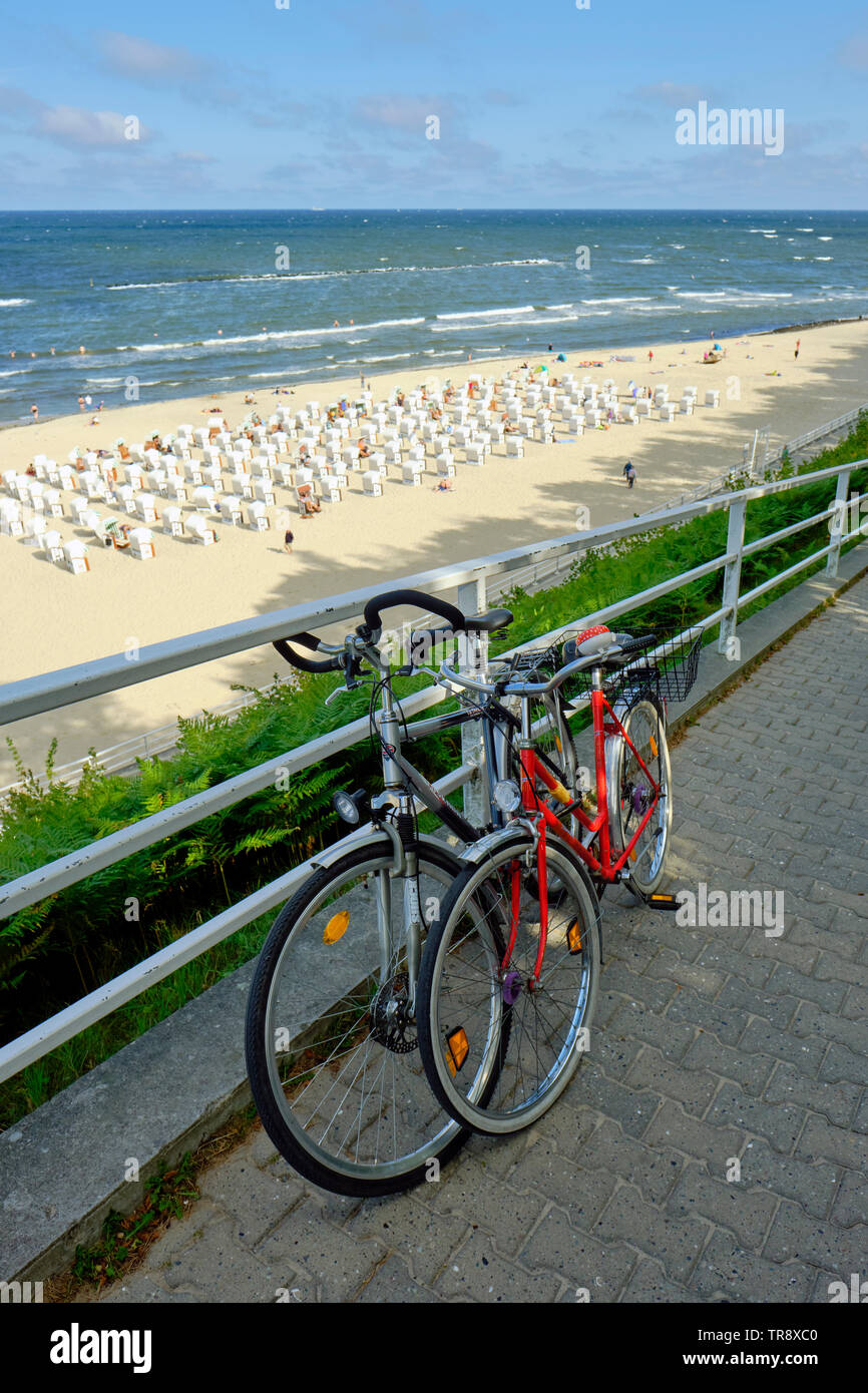 Two parked bicycles on the coast at Sellin on Rugen island on the Baltic Sea coast of Germany Stock Photo