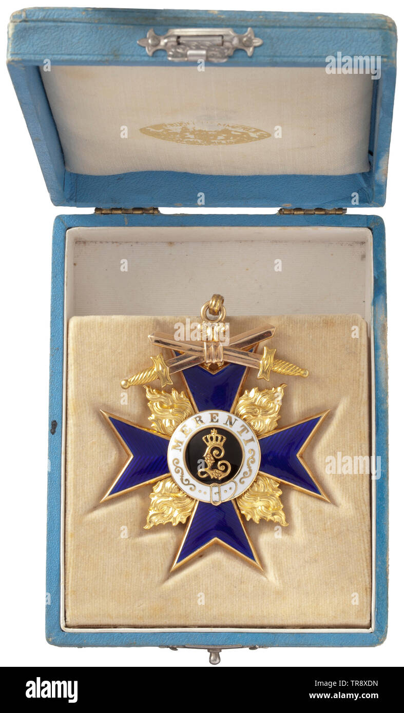 A Military Merit Order - 2nd Class with Swords, in its case Neck cross in gold from Jacob Leser's workshop in Straubing, mark of fineness '750' in the eyelet. These orders crosses from the first years of the World War rank justifiably among the most beautiful decorations of the order. The use of bicoloured gold and Leser's most accomplished enamelling technique imparts an unmatched charisma to these pieces. The suspension ring is replaced with a smaller eyelet. The award case is in the typical blue World War issue with outward foldable inlay and , Additional-Rights-Clearance-Info-Not-Available Stock Photo