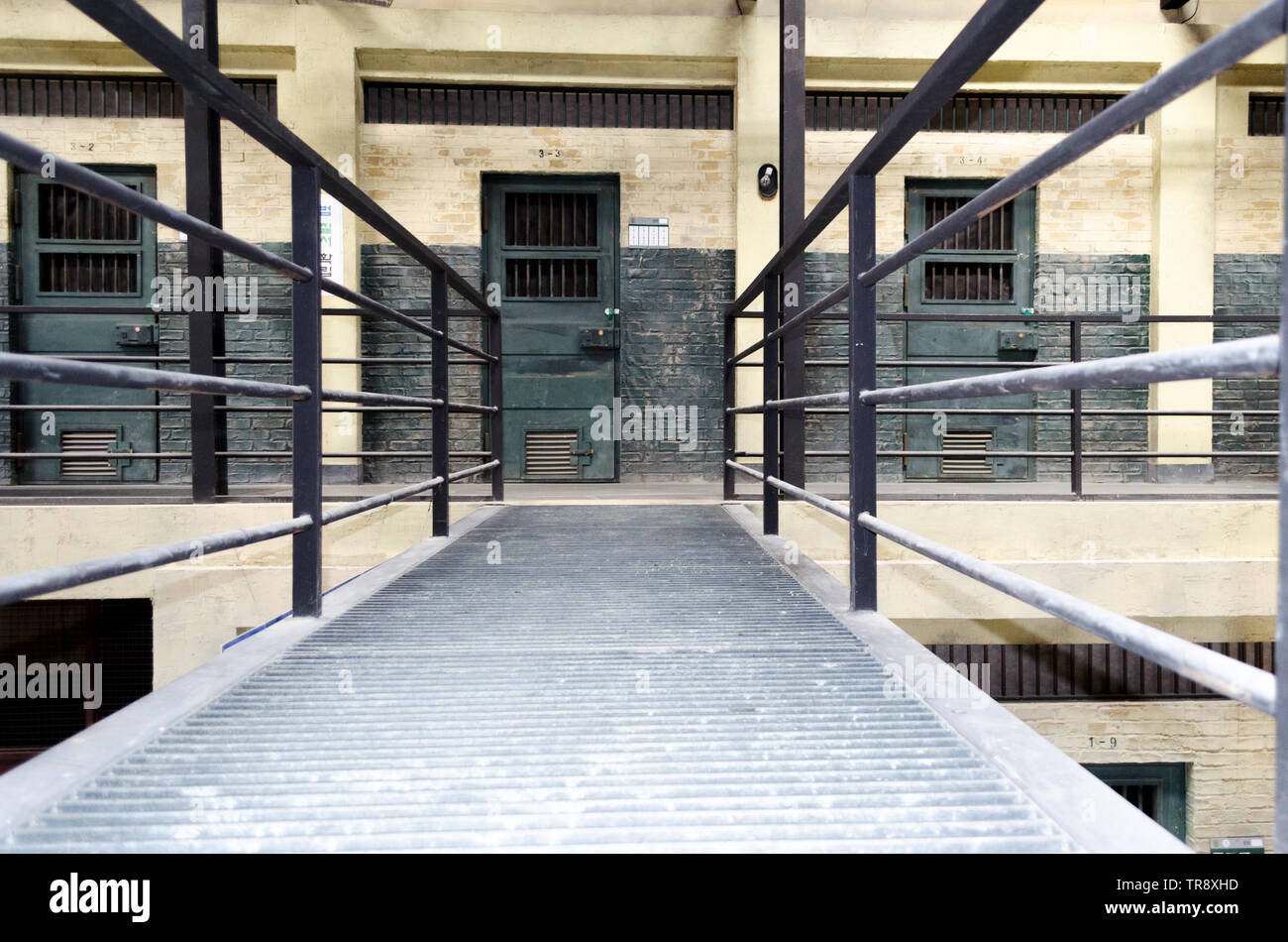 Prison interior. Jail cells and shadows, dark background. 3d illustration Stock Photo