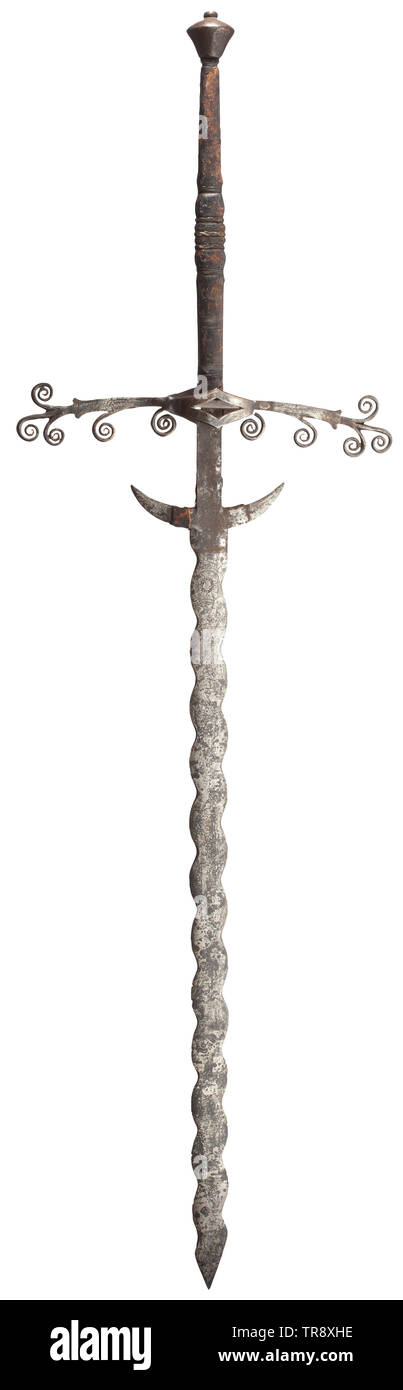 A two-handed flamberge, a high-grade collector's reproduction in the style of the 16th century Wavy blade with downcurved guards, above the guards on one side an etched coat of arms and the date 1597, on the other the image of a warrior and floral ornaments. Ricasso with remains of leather cover. Extended cross-guard with volute ornaments, symmetrical side rings and guard plates within. Leather-covered grip with wire winding. Conical pommel with small riveted finial. Length 176 cm. Decorative replica, true to original. historic, historical, sword, Additional-Rights-Clearance-Info-Not-Available Stock Photo