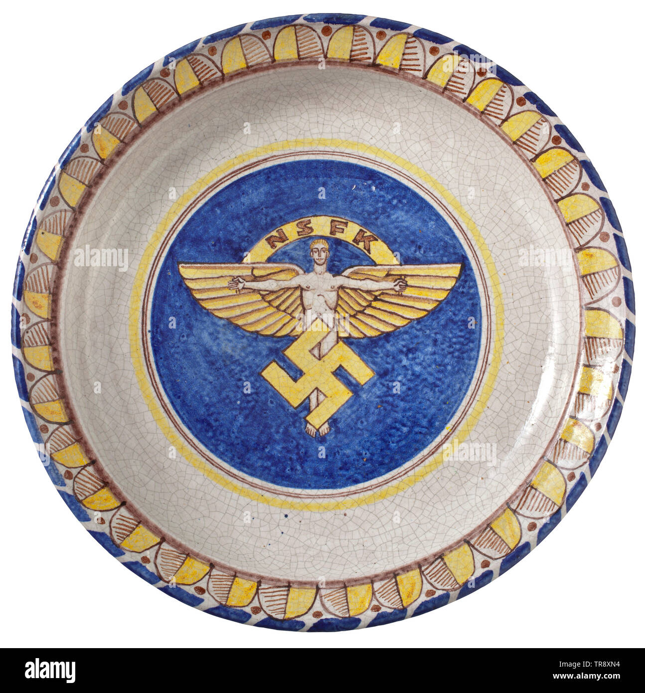 A large hand-painted wall plate Glazed stoneware. Coloured underglaze painting with ornamented border and NSFK (National Socialist Flyers Corps) symbol in the centre. Hand-written underglaze initials 'ST' on the reverse side. Glaze with craquelure. Diameter 35 cm. Rare. historic, historical, organisation, organization, organizations, organisations, 20th century, Additional-Rights-Clearance-Info-Not-Available Stock Photo