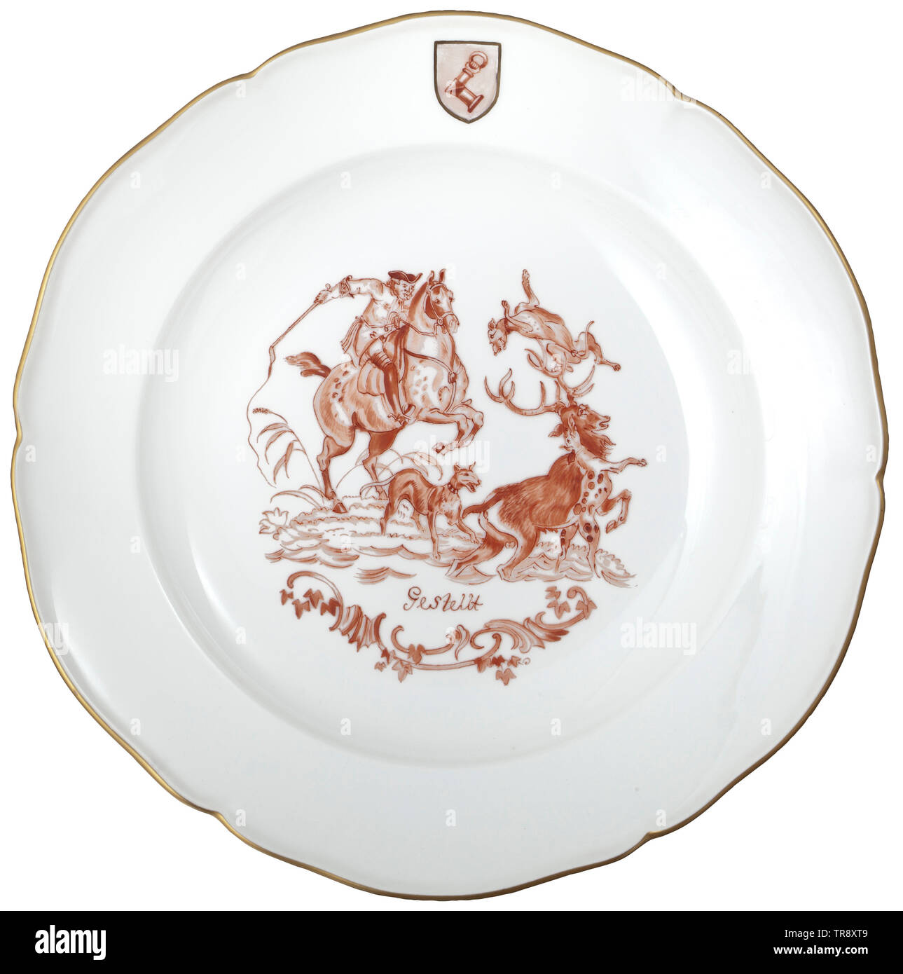 Hermann Göring - a KPM soup plate 'Cornered' from the iron-red decorated hunting dinner service of the Royal Prussian Porcelain Factory in Berlin White, glazed porcelain with curved gold rim and iron-red decoration, very finely painted portrayal of a courtly deer hunt of the 18th century, underneath the banner titled 'Cornered', on the border Göring's coat of arms. Blue underglaze sceptre mark and globus cruciger mark in red overglaze at the bottom. Diameter 24.7 cm. Rare. historic, historical, 20th century, 1930s, NS, National Socialism, Nazism, Third Reich, German Reich, , Editorial-Use-Only Stock Photo