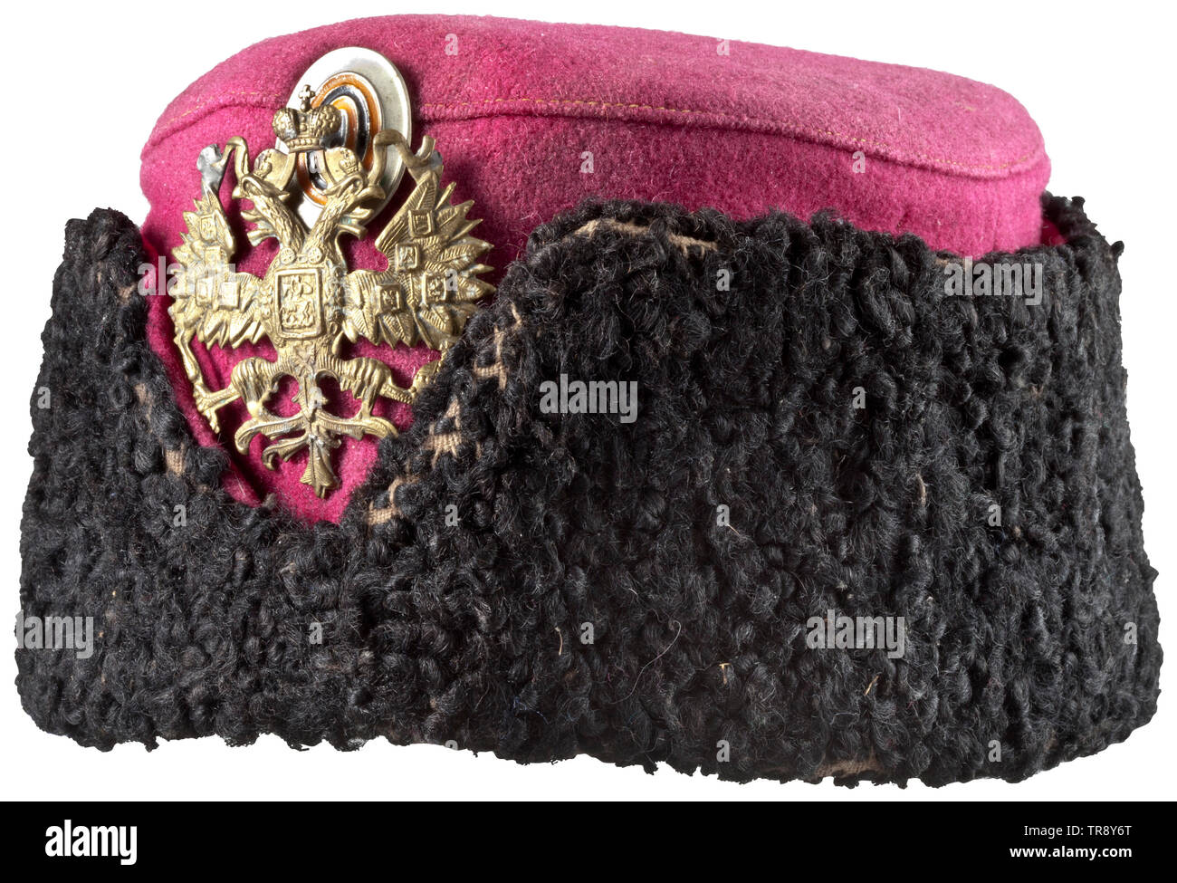 A Russian busby for enlisted men of a Uhlan regiment, circa 1910 Of black karakul fur and crimson red wool cloth. The obverse with embossed Russian double-headed eagle (with one repair and flaw) and metal cockade. Linen lining with several indistinct stamps. Signs of age, some moth damage. historic, historical, 20th century, Additional-Rights-Clearance-Info-Not-Available Stock Photo