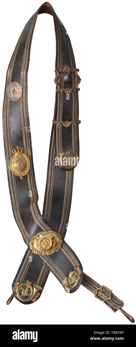 A German hunting bandolier, dated 1902 Leather dyed in dark green with gilt silver braid (slightly damaged, darkened) and decorated with oak leaf- and hunting horn appliqués in fine relief. On the front a chased, crowned medallion with ruler's cypher 'A' and circumscription 'Gott mit uns' (God with us). Old inscription 'Schröder Juli 1902' (wearer's name?) on the reverse side. Traces of age and usage. Part of a court hunter's or gunsmith's equipment. historic, historical, hunt, hunts, hunting, utensil, piece of equipment, utensils, trophies, obje, Additional-Rights-Clearance-Info-Not-Available Stock Photo