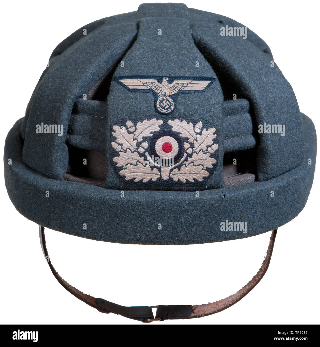 A rare assault gun protective cap Experimental type, field-grey wool covering with open work design. Hand-sewn BeVo eagle and wreath/cockade combination. Green leather lining, size stamp '57', chin strap and perforated tabs. Cf. 'Uniforms, Organizations, and History of Armored Troops' by Bender/W. Odegard. Only four items known to exist. USA-lot, see page 4. historic, historical, 20th century, armoured corps, armored corps, tank force, tank forces, branch of service, branches of service, armed service, armed services, military, militaria, utensil, piece of equipment, utensi, Editorial-Use-Only Stock Photo