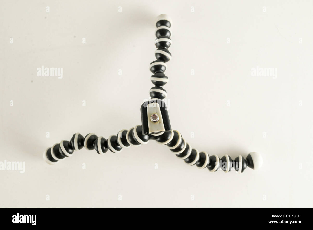Mini table flexible tripod on white background Stock Photo