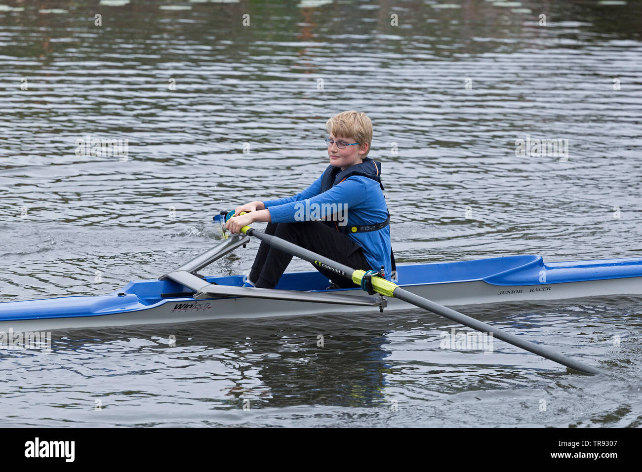 boy rowing single scull, rowing club Wilhelmsburg, Hamburg, Germany Stock Photo