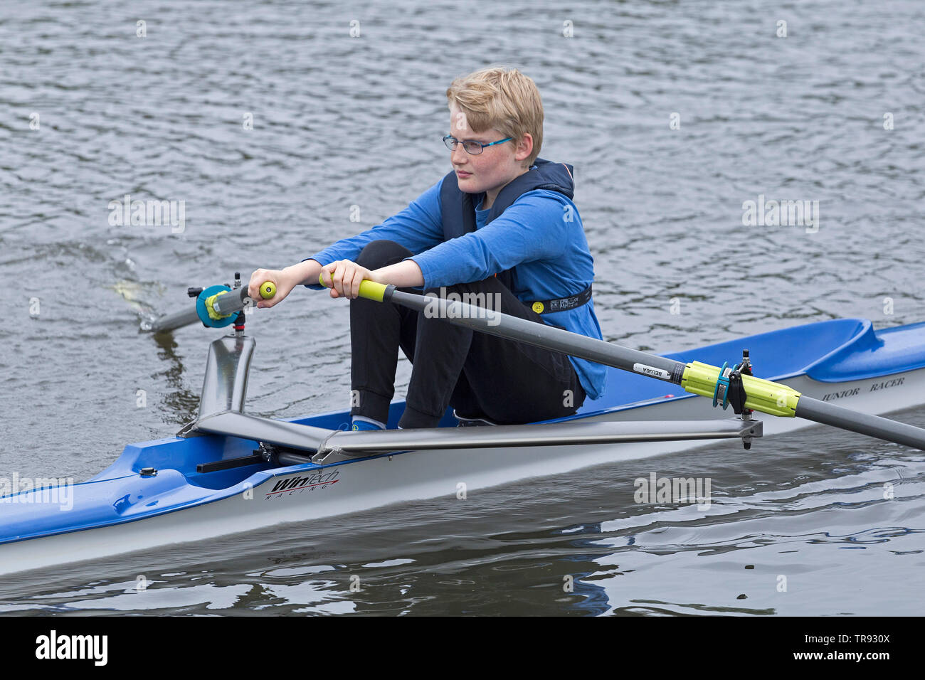 boy rowing single scull, rowing club Wilhelmsburg, Hamburg, Germany Stock Photo