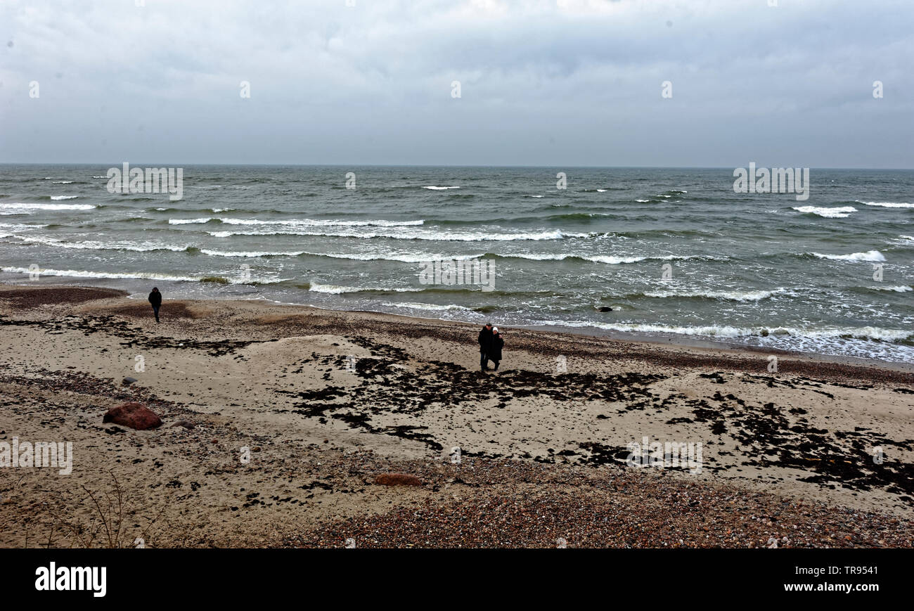 Couple walking on the sand of a beach,Karkelbeck,Ostsee,Memelland.Karkle in Lithuania. Stock Photo