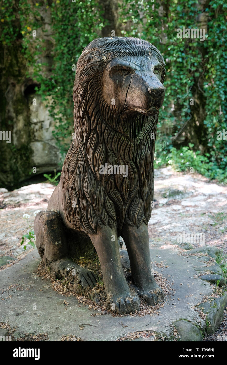 A wooden carving of Aslan the lion from The Lion, The Witch and the Wardrobe, in How Stean Gorge, Yorkshire Dales, Yorkshire Stock Photo
