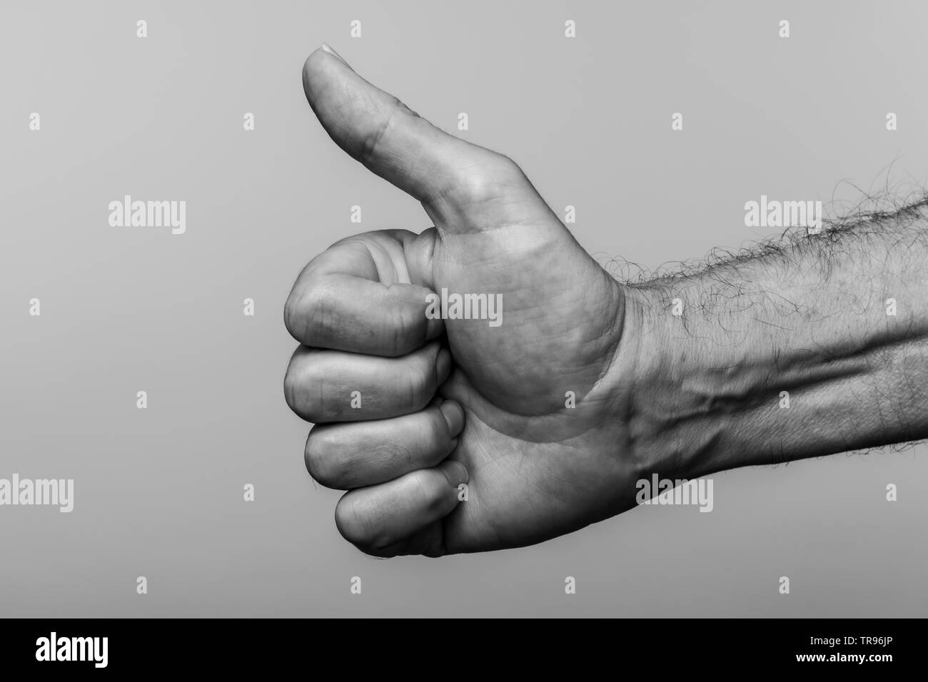 close up of a mans hand, thumbs up gesture. Stock Photo