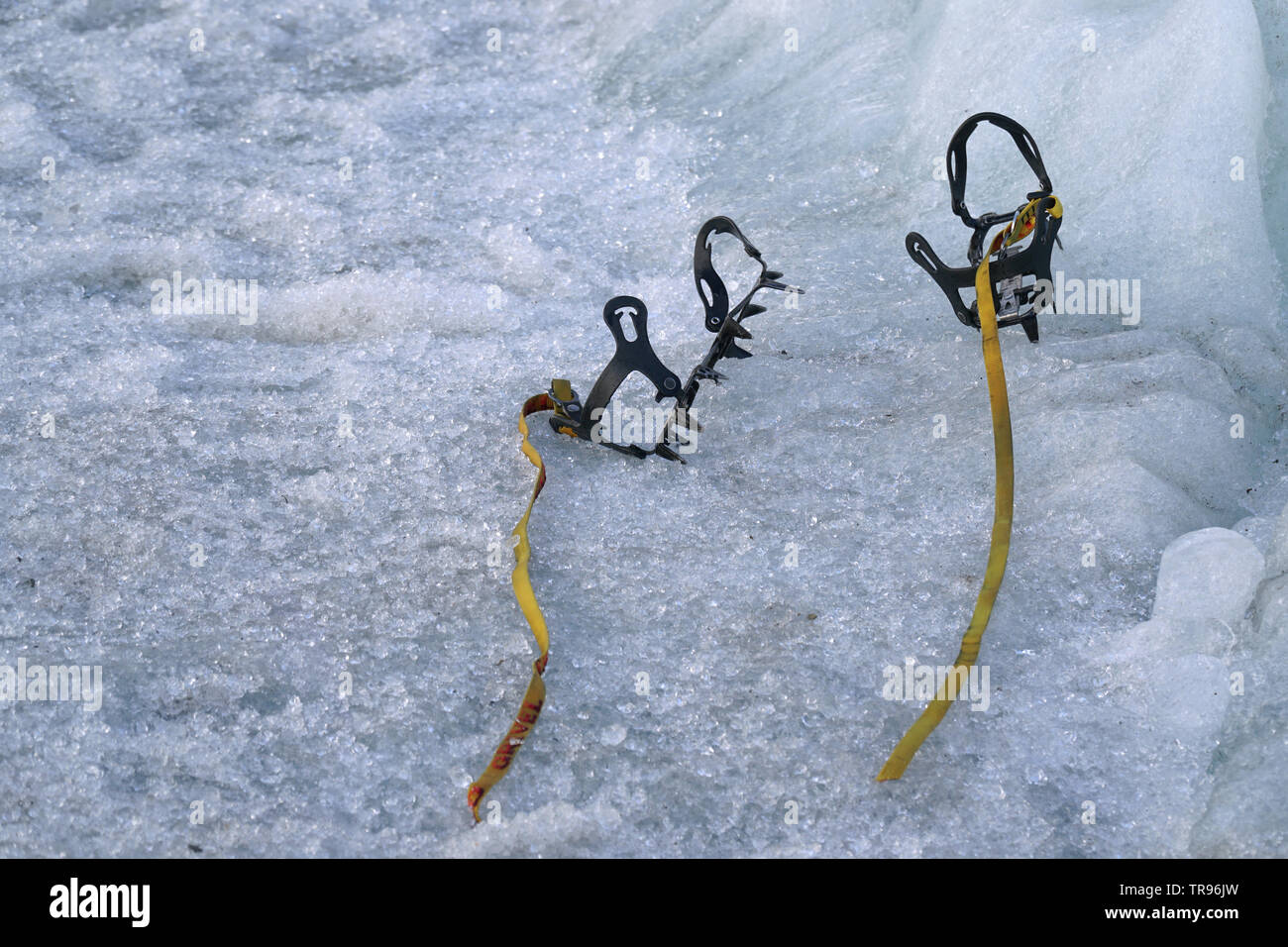 closeup of crampons without boots left behind on ice Stock Photo