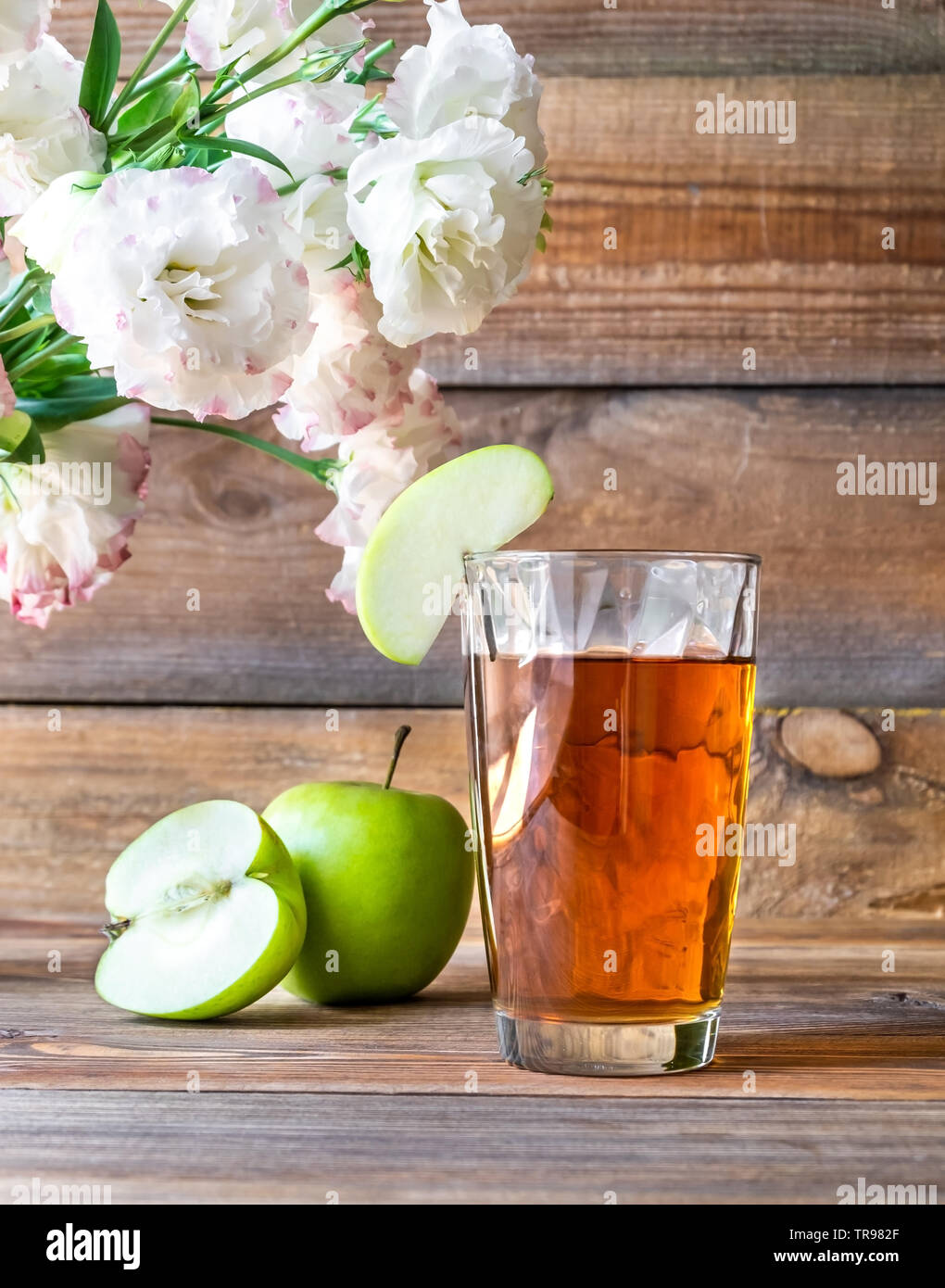 Glass of apple juice with fresh apples on the wooden background Stock Photo