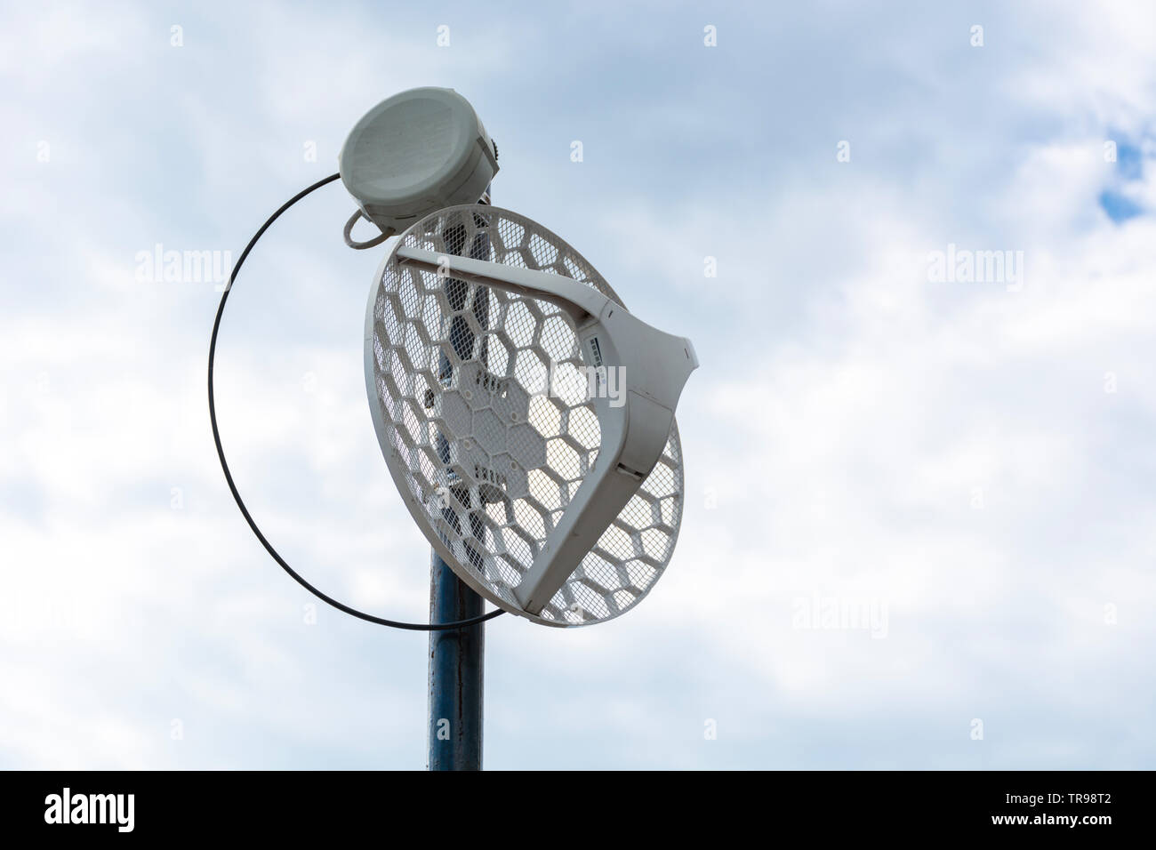 Internet outdoor antenna metal rod on the roof and cloudy sky in the background. Modern technology and internet concept. Close up Stock Photo - Alamy