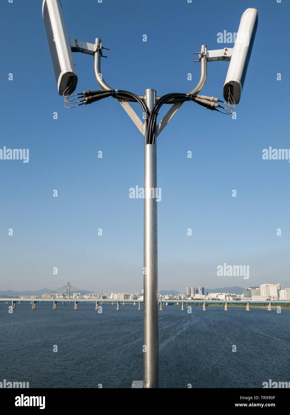 Antennas similar to speakers on the pole in the Jamsil Bridge over the Han river. Stock Photo