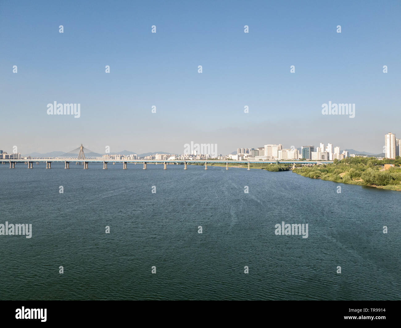 Han river over the Jamsil bridge. There is a Olympic bridge near horizon Stock Photo