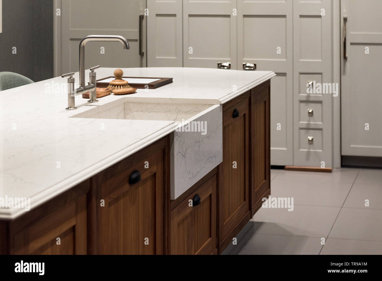 Marble Granite Top Kitchen Island with Sink and Accessories Stock Photo