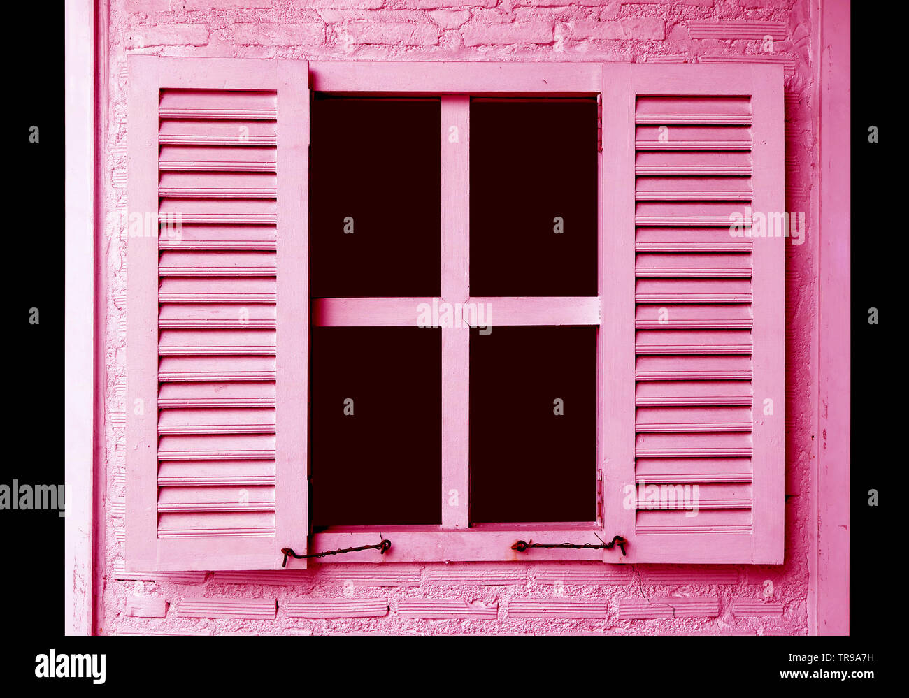 Pink colored window shutters on the pink brick wall Stock Photo - Alamy