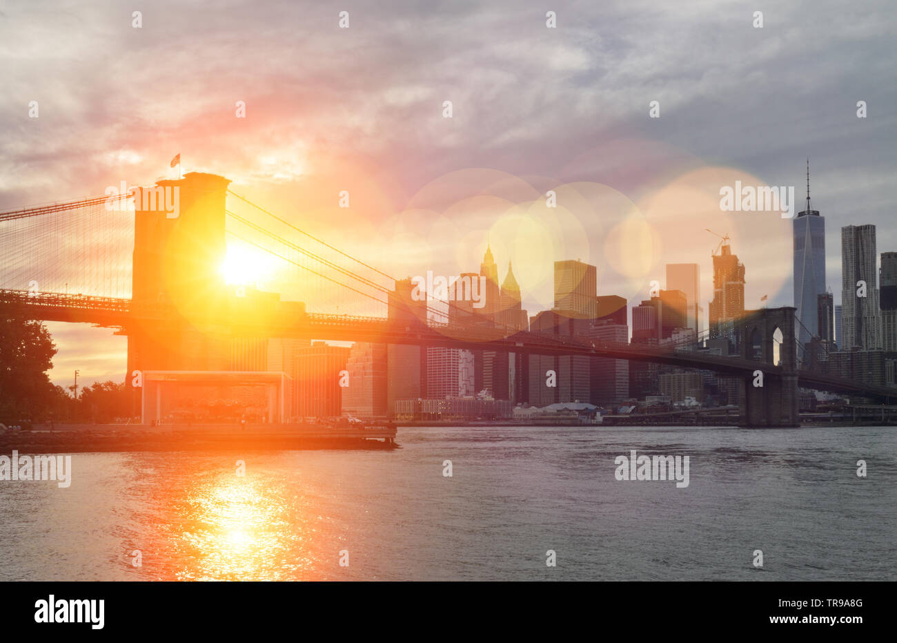 Beautiful sunset over a Brooklyn Bridge in New York City Stock Photo ...