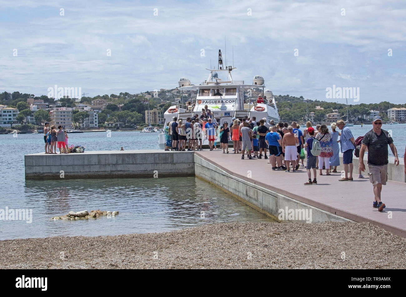 SANTA PONSA, MALLORCA, SPAIN - MAY 29, 2019: Small ferry Tropical and bridge with passengers leaving on May 29, 2019 in Santa Ponsa, Mallorca, Spain. Stock Photo