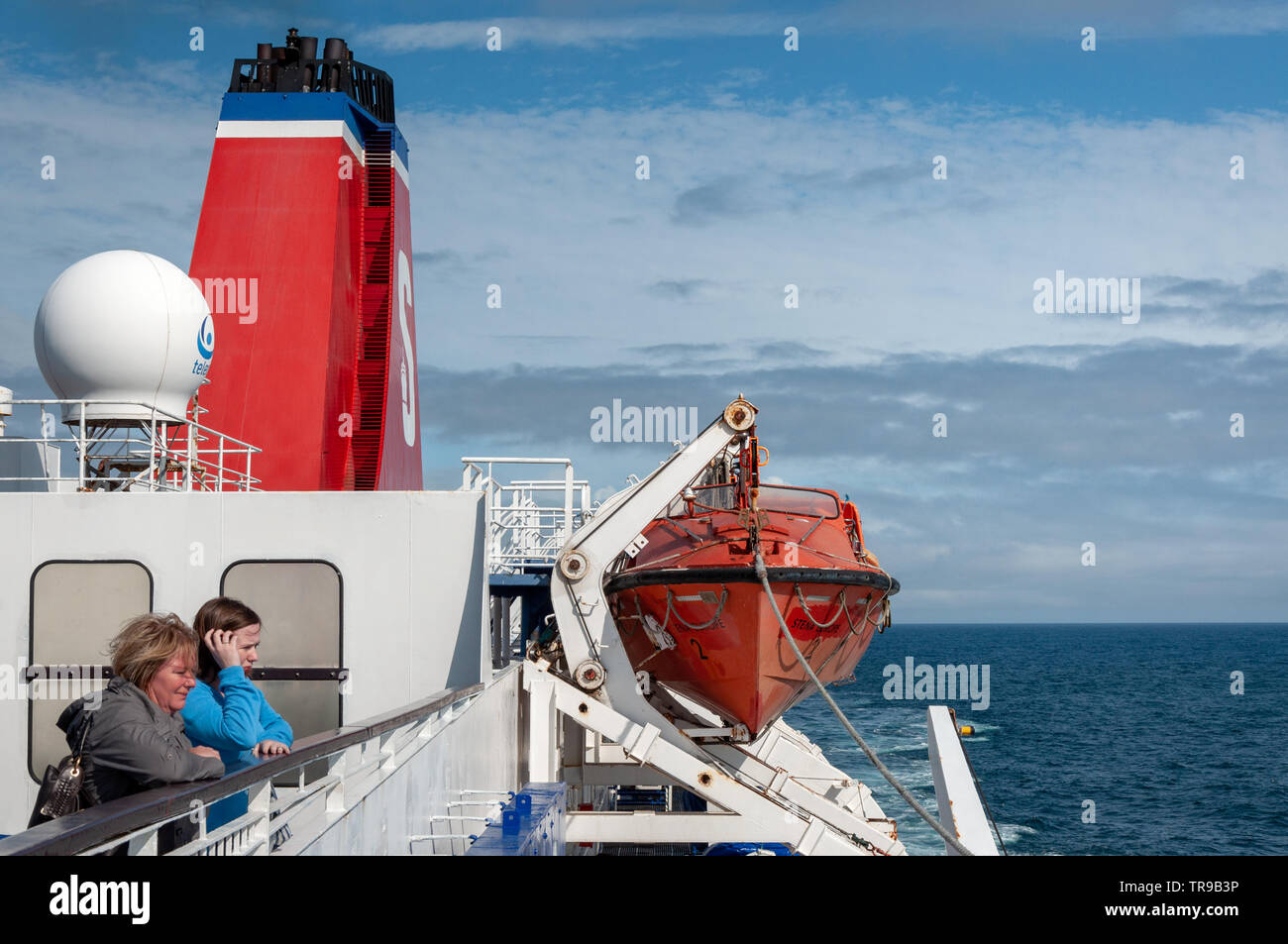 Stena Line ferry female passengers on ferry deck and open sea Stock Photo