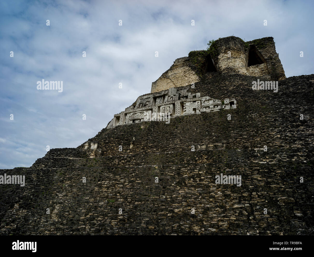 Low angle view of ruins of Mayan pyramid, Ancient Mayan Archaeological Site, San Jose Succotz, Cayo District, Belize Stock Photo