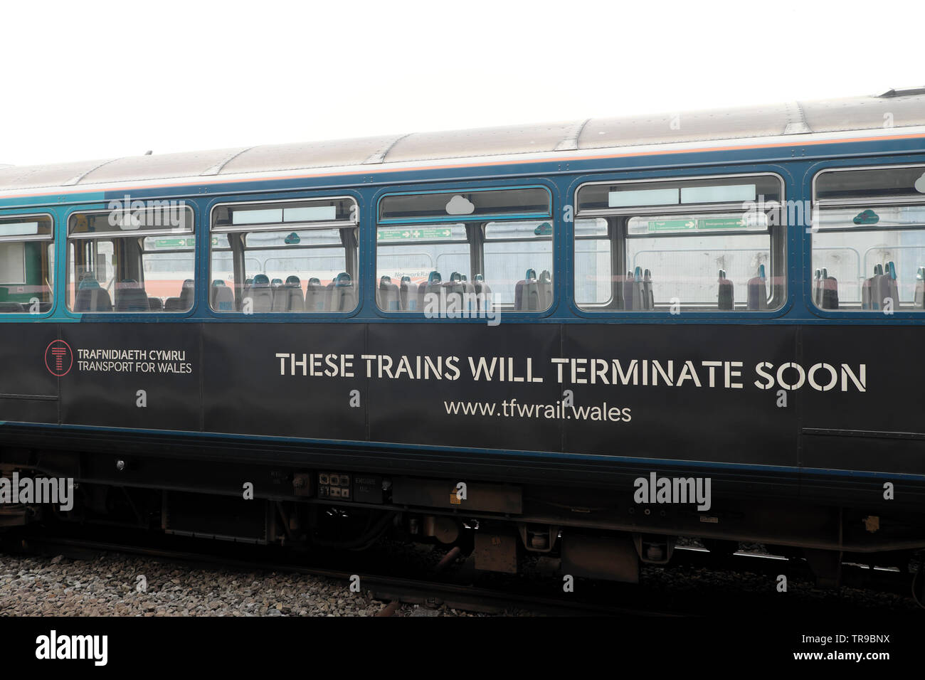Transport for Wales side of train carriage text with notice 'These Trains Will Terminate Soon' sign in Cardiff Wales UK 2019  KATHY DEWITT Stock Photo