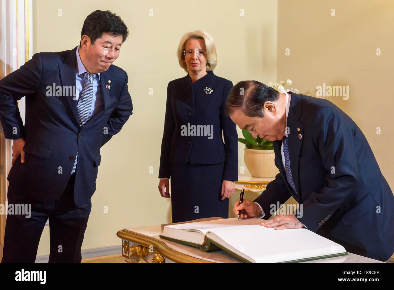 Riga, Latvia. 31st May 2019. Moon Hee-sang, Speaker of the National Assembly of the Republic of Korea writes at guest book, during meeting with Inara Murniece, Speaker of Parliament of Latvia. Parliament of Latvia (Saeima). Stock Photo