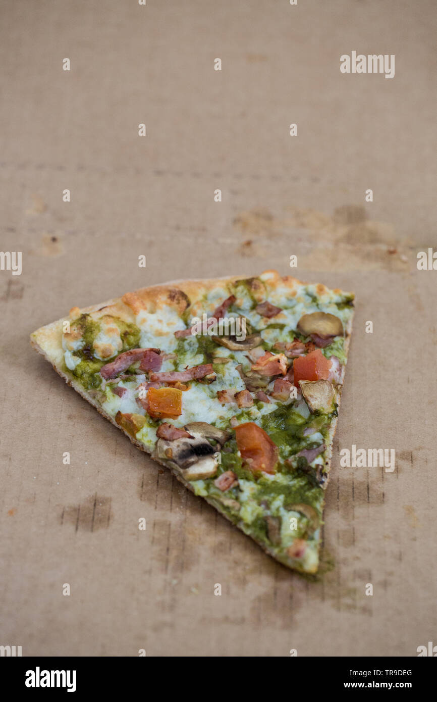 Last one pizza slice in cardboard pizza box. Book cover template. Stock Photo