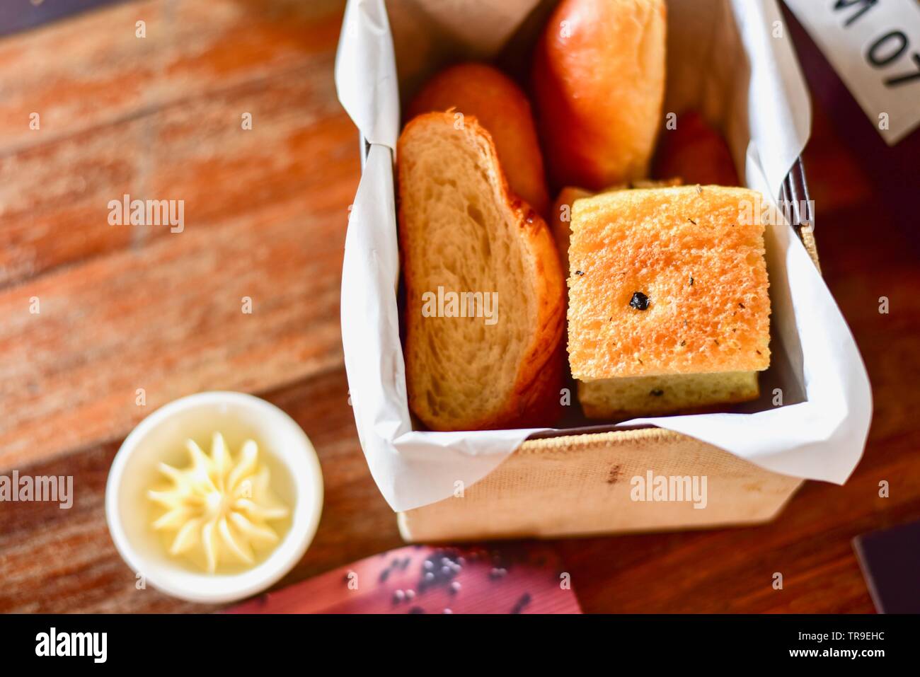 French Bread Assortment in Bread Basket on Rustic Table Stock Photo Alamy