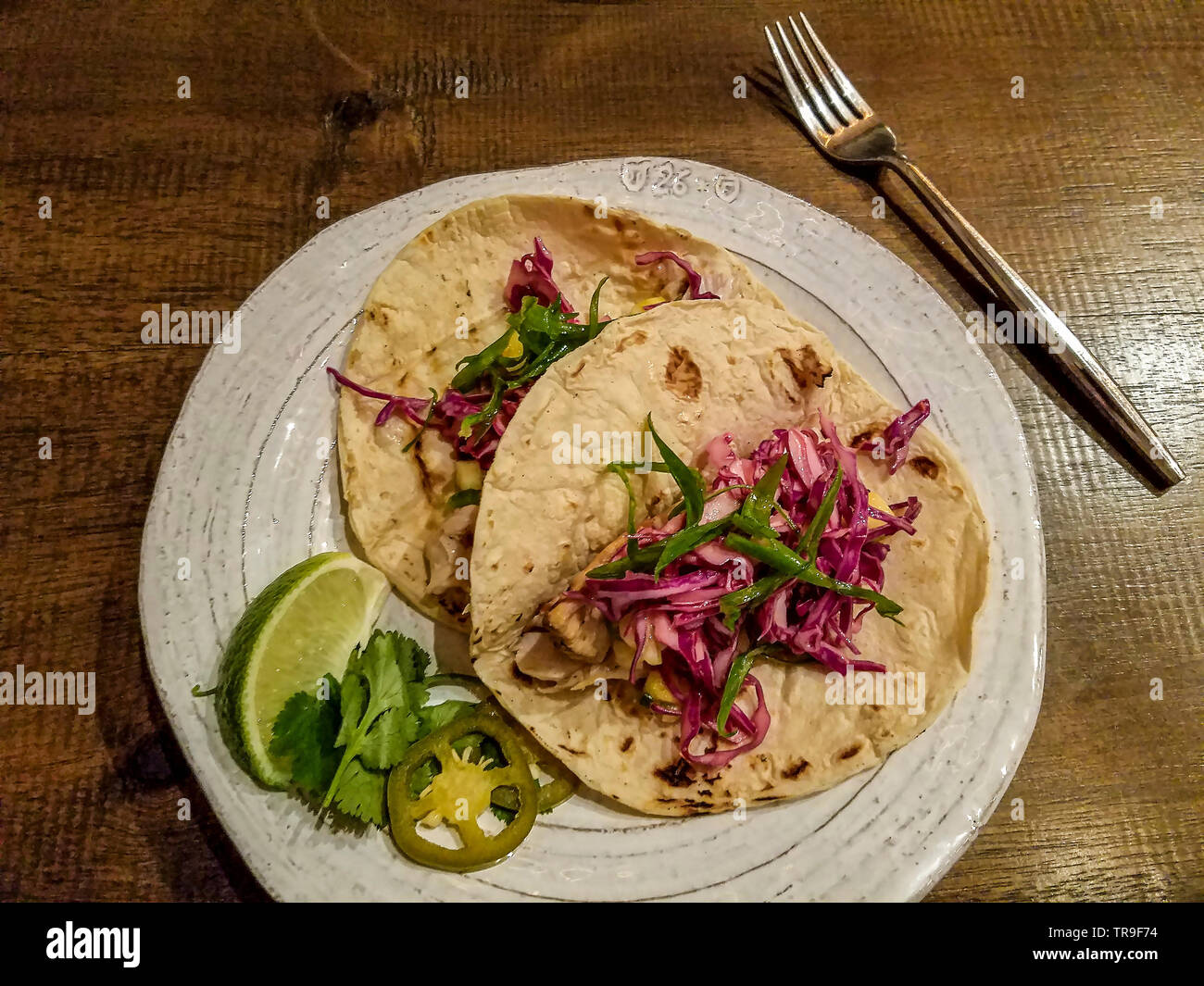 Grilled Mahi Tacos with shredded cabbage and lime Stock Photo Alamy